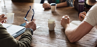 People working while drinking coffee